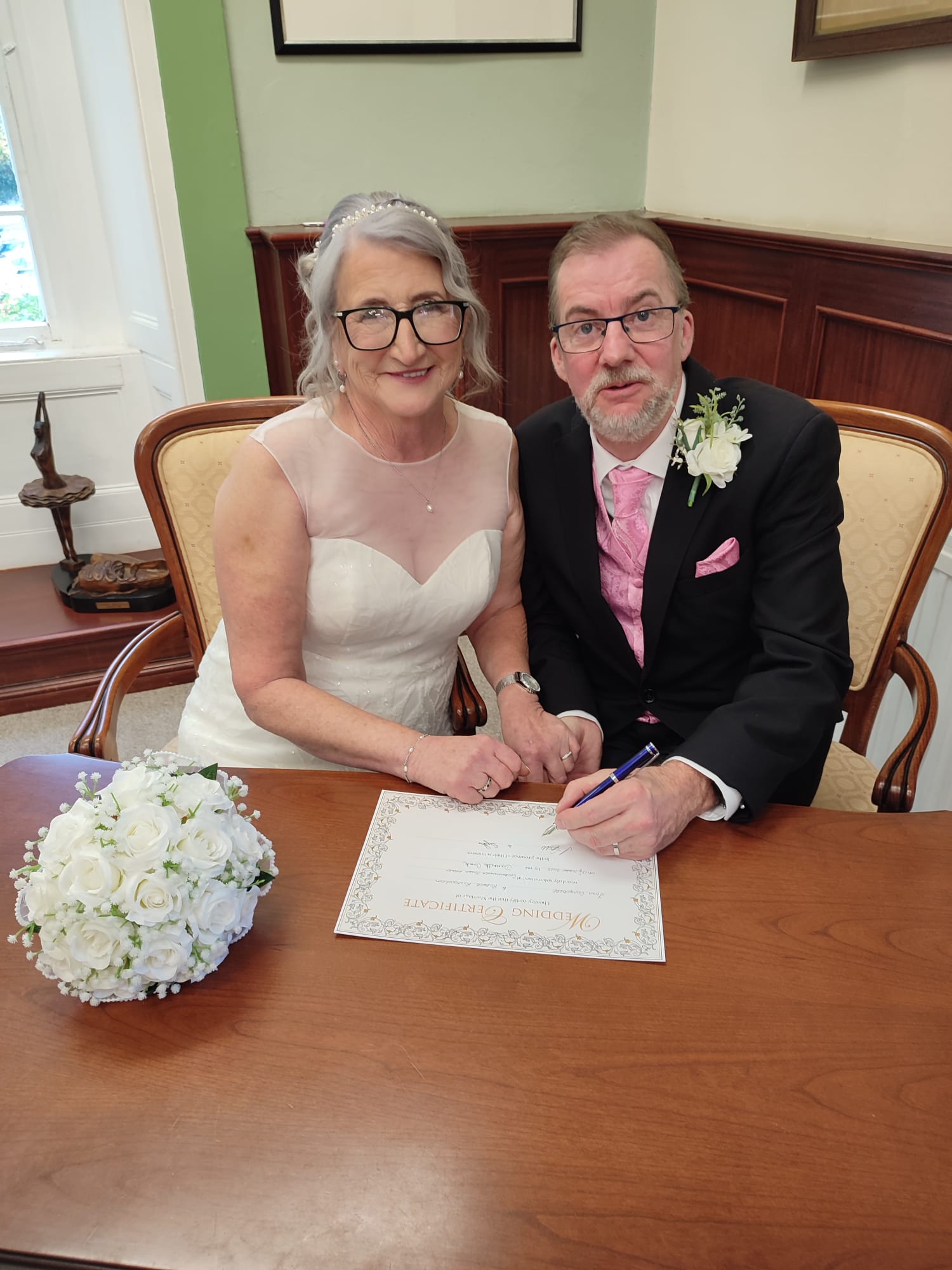 Couple signing Register